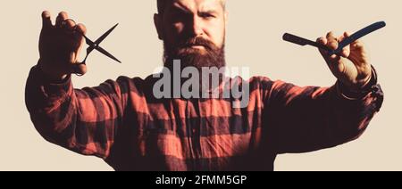 Barber scissors and straight razor, barber shop. Male in barbershop. Mens haircut in barber shop. Mens haircut, shaving Stock Photo