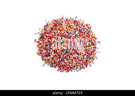 candy sprinkles arranged in a heap pile on a bright white counter table studio as a food scene Stock Photo