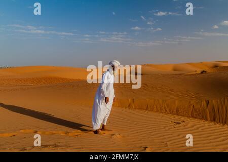 AL WASIL, OMAN - MARCH 5, 2017: Local bedouin in the sand dunes of Sharqiya Wahiba Sands near Al Wasil village. Stock Photo