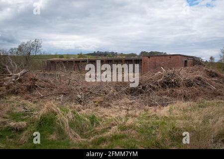 Closer view of an old WW2 rifle range at Craigs Moss, Dumfries, Scotland.  This show shows metal supports and covered area used by service personnel. Stock Photo