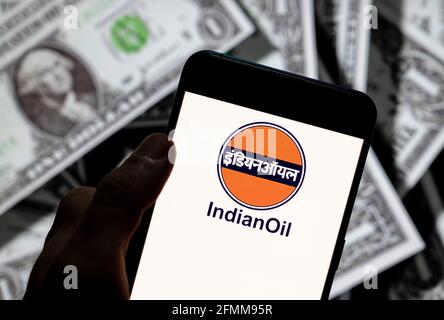 China. 21st Apr, 2021. In this photo illustration the Indian Oil company logo seen displayed on a smartphone with USD (United States dollar) currency in the background. (Photo by Budrul Chukrut/SOPA Images/Sipa USA) Credit: Sipa USA/Alamy Live News Stock Photo