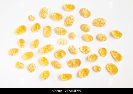 corn flakes isolated on white background, food ingredient, yellow corn cereal for breakfast, heap of sugar-coated corn flakes cutout Stock Photo