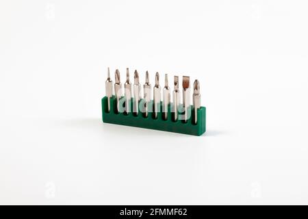 A set of screwdriver bits for a magnetic screwdriver on a white background. Stock Photo