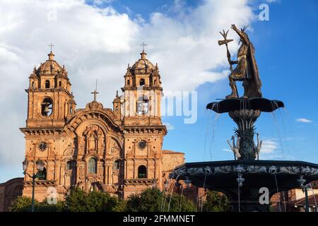 Statue of Inca Pachacutec on fountain and catholic church on Plaza de Armas, Cusco or Cuzco town, Peru Stock Photo