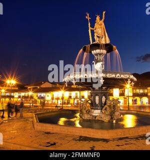 Statue of Inca Pachacutec on fountain on Plaza de Armas, night view,  Cusco or Cuzco town, Peru Stock Photo