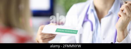 Doctor writes the patient prescription for marijuana Stock Photo