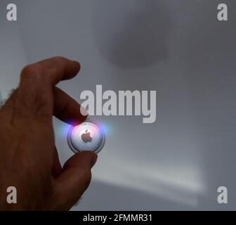 Man pov looking at AirTag by Apple Computers Inc Stock Photo