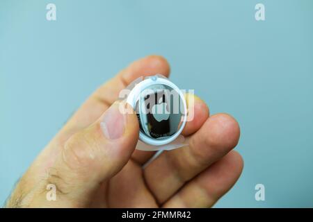Man pov looking at AirTag by Apple Computers Stock Photo