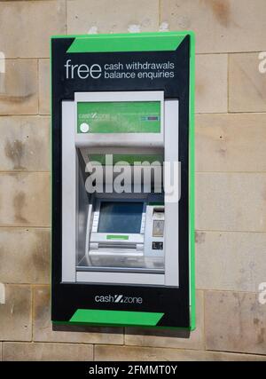 Hastings, United Kingdom - August 01 2020:  A Cashzone ATM hole in the wall cash machine on Station Appraoch Stock Photo