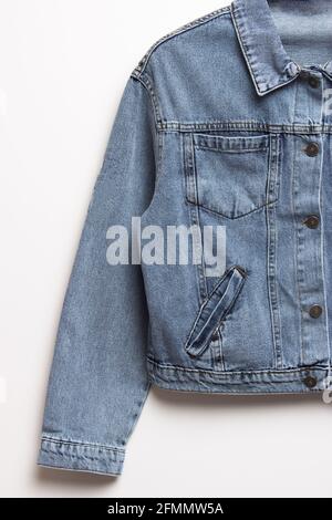 Blue denim jacket for background. Close up of the front of a denim jacket. Close-up denim jacket pocket. Denim texture background. Stock Photo