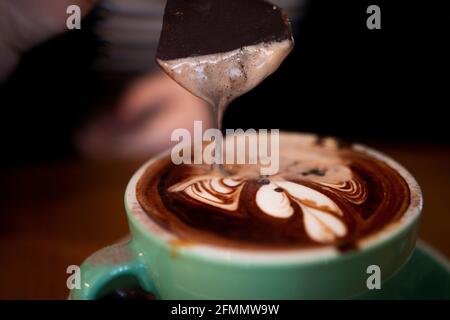 Melting Chocolate Drips into Mocha Coffee Stock Photo