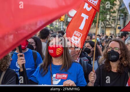 Barcelona, Spain. 10th May, 2021. Protesters hold flags of the banking unions during the demonstration.Some 1,500 workers of the Spanish bank BBVA have been summoned by the banking unions of Catalonia in front of a bank headquarters in Barcelona against the Employment Regulation File (ERE) that affects the dismissal of almost 3,800 employees. Credit: SOPA Images Limited/Alamy Live News Stock Photo