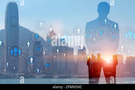 Social network and global recruitment. Virtual screen with world map and blue peoples icons. Stock Photo