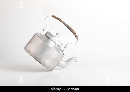 Aluminum tea kettle or tea pot on white background. Stock Photo