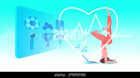 woman doing sport exercises in salamba sirsasana pose while watching video fitness on laptop online training Stock Vector