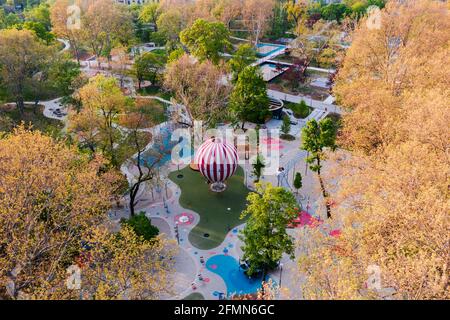 Budapest City park big playground in aerialpanormaic photo. Renwed nice play place for children all ages. Amazing bright morning lights. Stock Photo