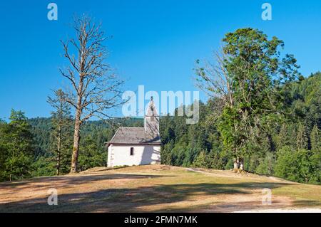 Little chapel by Longemer lake, Ballon des Vosges Regional Natural Park, Vosges (88), Grand Est region, France Stock Photo