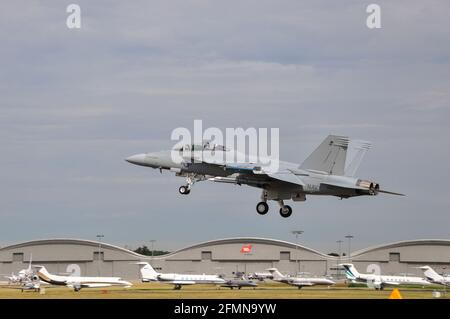 Boeing F/A-18F Super Hornet fighter jet plane at Farnborough International Airshow 2010. Developed from McDonnell Douglas F-18. Demonstration flight Stock Photo