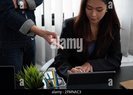 Business adviser analyzing financial figures denoting the progress in the work of the company. Stock Photo