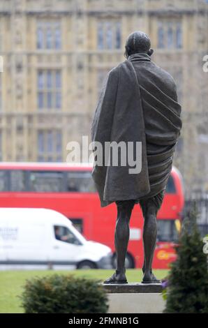 London, England, UK. Statue of Mahatma Gandhi, Parliament Square. (2015: Philip Jackson) Ereected mark the 100th anniversary of his return to India to Stock Photo