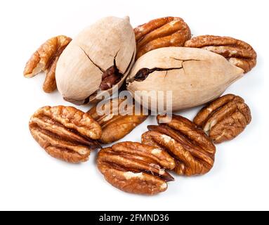 several shelled and unshelled pecan nuts closeup on white Stock Photo