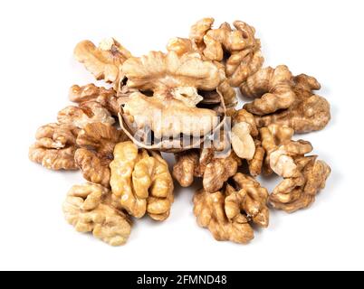 pile of shelled and cracked walnuts closeup on white background Stock Photo