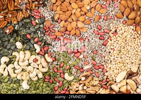 top view of various shelled nuts and seeds on table Stock Photo