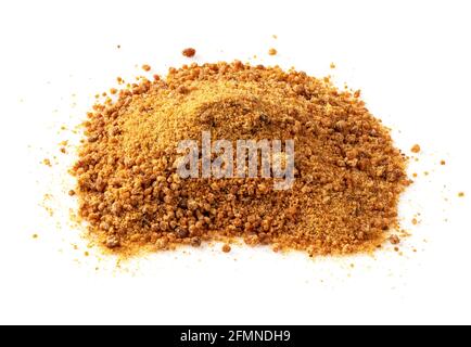 handful of granulated coconut blossom sugar closeup on white plate Stock Photo