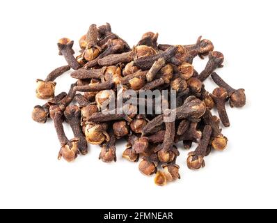 pile of dried cloves closeup on white background Stock Photo
