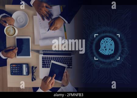 Businessman using fingerprint to access technology against digital Business Safety Internet scan fingerprint id  future of security and password Stock Photo