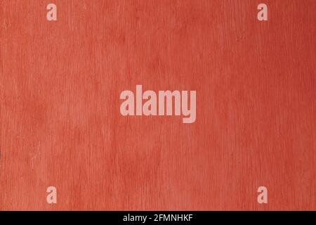 old red painted plywood flat surface texture and background with even vertical cracks Stock Photo