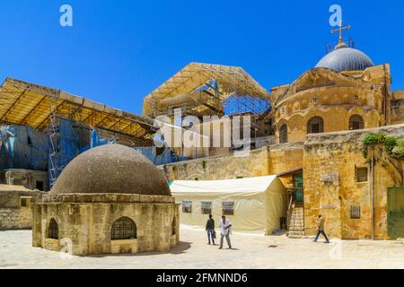 Jerusalem, Israel - May 01, 2021: View of the courtyard of Deir es-Sultan of the Ethiopian Orthodox Tewahedo Church, with locals, in the Holy Sepulchr Stock Photo