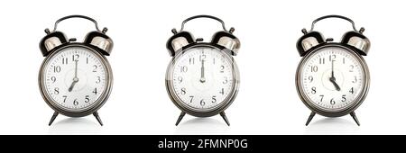 Old vintage alarm clocks at different time of the days isolated on panoramic white background. Morning, noon,afternoon,evening concept Stock Photo