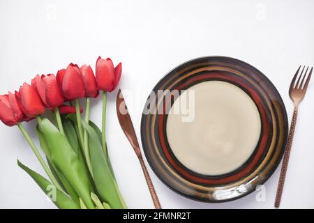 cutlery and empty plate on white background top down Stock Photo