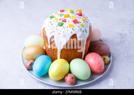 Easter cake with candied fruits and colored eggs. Traditional Easter baking. Easter holiday. Close-up. Stock Photo