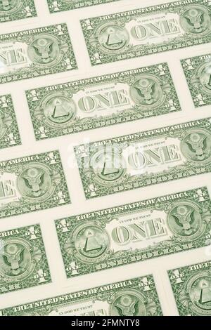Reverse side of US $1 / one dollar bills with ONE dollar word & arranged in formation. For US trillion $ debt mountain, US banking crisis, US savings. Stock Photo