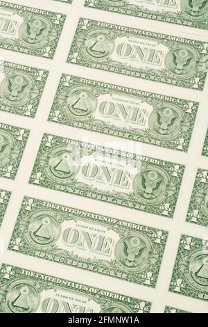 Reverse side of US $1 / one dollar bills with ONE dollar word & arranged in formation. For US trillion $ debt mountain, US banking crisis, US savings. Stock Photo