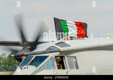 Italian Air Force, Aeronautica Militare Alenia C-27J Spartan transport plane at Royal International Air Tattoo, RIAT, RAF Fairford, UK. Crew fly flag Stock Photo