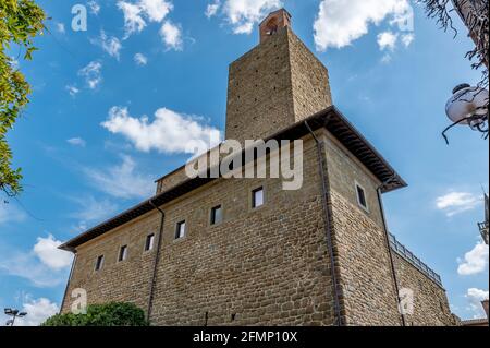The outer walls of the imposing castle of the Conti Guidi in the historic center of Vinci, Florence, Italy, against a beautiful sky Stock Photo