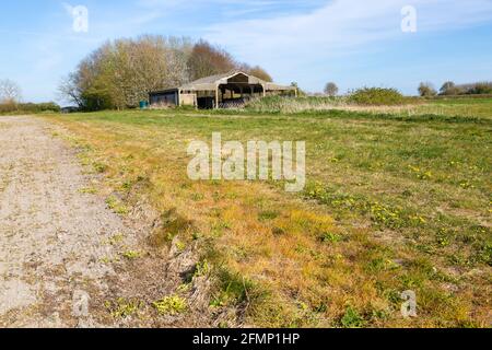 Chalk fields and barn landscape with blue sky, near Compton Bassett, Wiltshire, England, UK Stock Photo