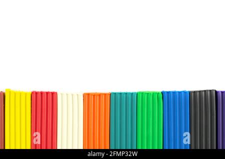 Multicolored bright plasticine on a white background, isolate Stock Photo