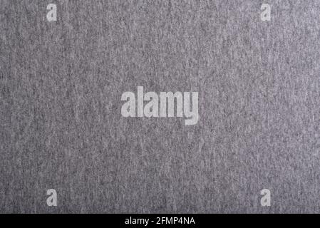 Gray homogeneous background. Textile. The surface of the fabric. Melange gray fabric. Stock Photo