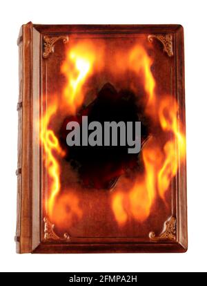 old book with a hole and on fire Stock Photo