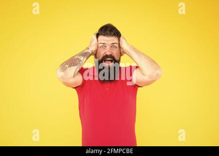 All is lost. Desperate looser yellow background. Crazy hipster feel lost. Bearded man hold head in frustration. Lost the game. Failed to win. Gambling Stock Photo