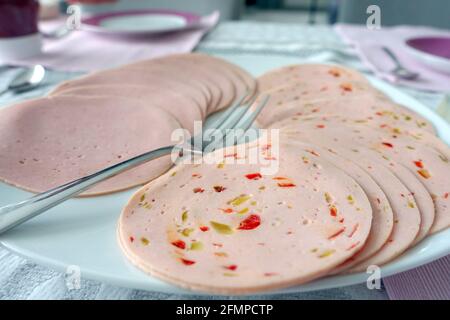 Oberkirch, Germany. 01st May, 2021. Slices of Lyoner and Paprikalyoner lie on a plate. Credit: Alexandra Schuler/dpa/Alamy Live News Stock Photo