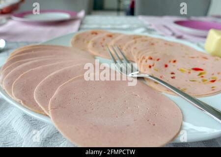 Oberkirch, Germany. 01st May, 2021. Slices of Lyoner and Paprikalyoner lie on a plate. Credit: Alexandra Schuler/dpa/Alamy Live News Stock Photo