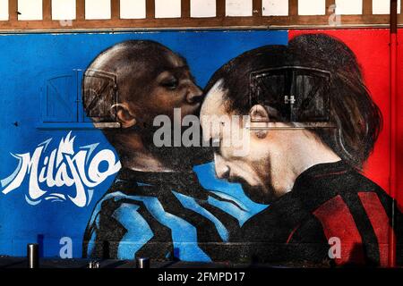 Milan, Italy. 14 February 2021. A mural depicting Romelu Lukaku of FC Internazionale and Zlatan Ibrahimovic of AC Milan is seen near stadio Giuseppe Meazza also known as San Siro. The mural was painted by street artists Stefania Marchetto known as SteReal and Marco Mantovani known as KayOne. Credit: Nicolò Campo/Alamy Live News Stock Photo