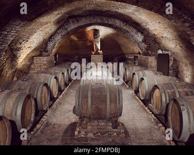 Ancient wine cellars located inside tufa caves. It is one of the cellars owned by the winery 'Cantine del Notaio', one of the most important wine prod Stock Photo