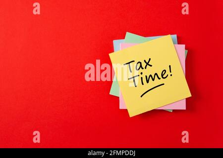 Tax time - Notification of the need to file tax returns and tax form with empty space for text. Stock Photo
