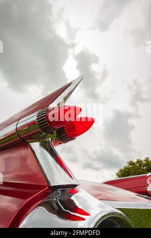 isolated view red bullet rear lights of vintage 1959 Cadillac Coupe de Ville at Stars & Stripes American Classic car show Stock Photo